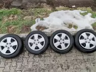 Метални Джанти с зимни гуми и тасове