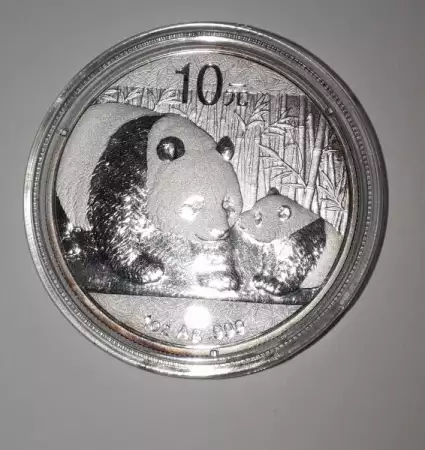 7. Снимка на Купувам сребърни монети Панда и Кукабура.