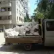 . Снимка на Извозва строителни отпадъци с бус - самосвал