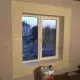 . Снимка на Боядисване Шпакловане Обръщане на прозорци и врати.